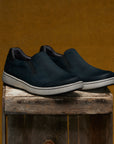 Men's slip-on sneakers in soft black leathers with a casual outsole.