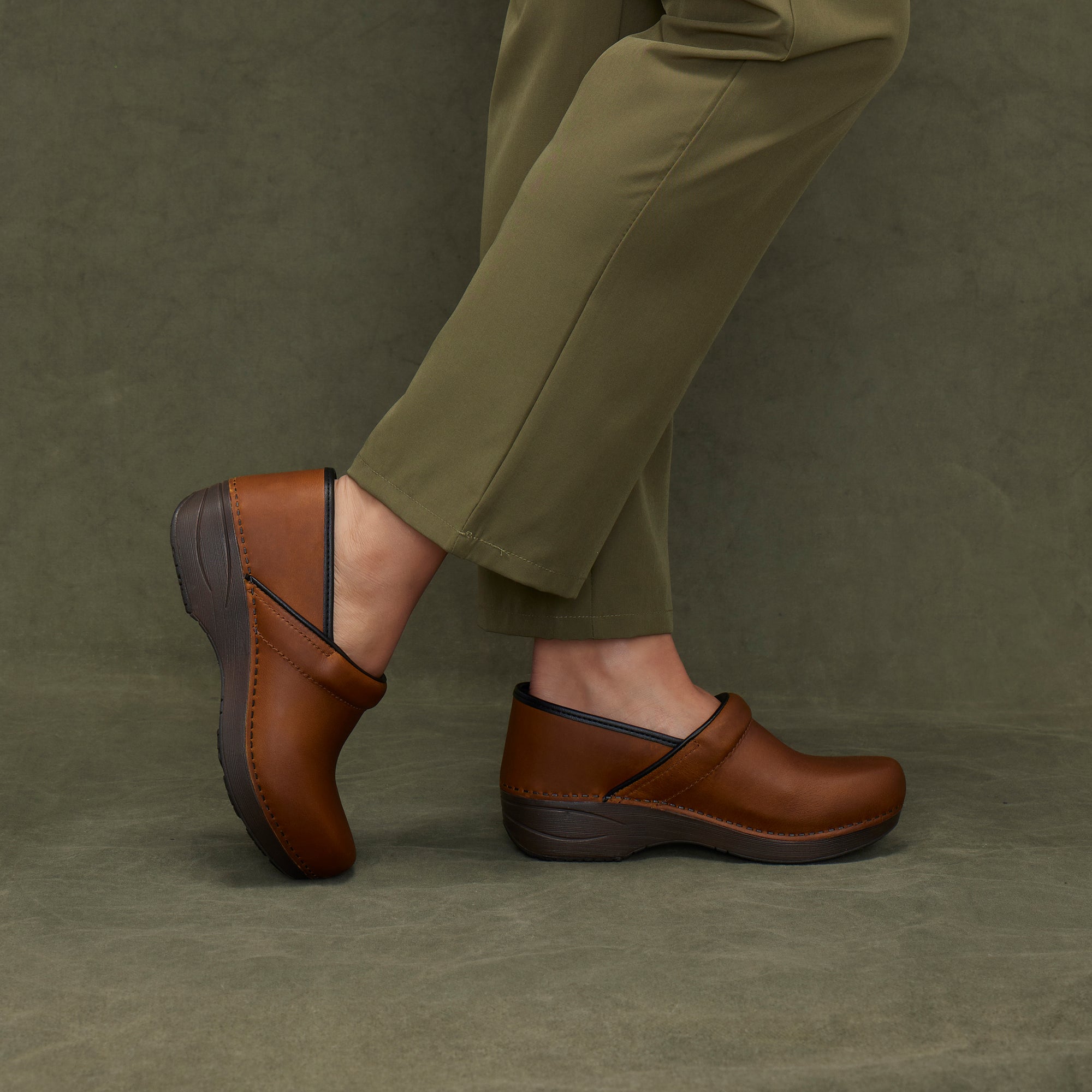 An on-foot look at rich brown leather XP clogs.