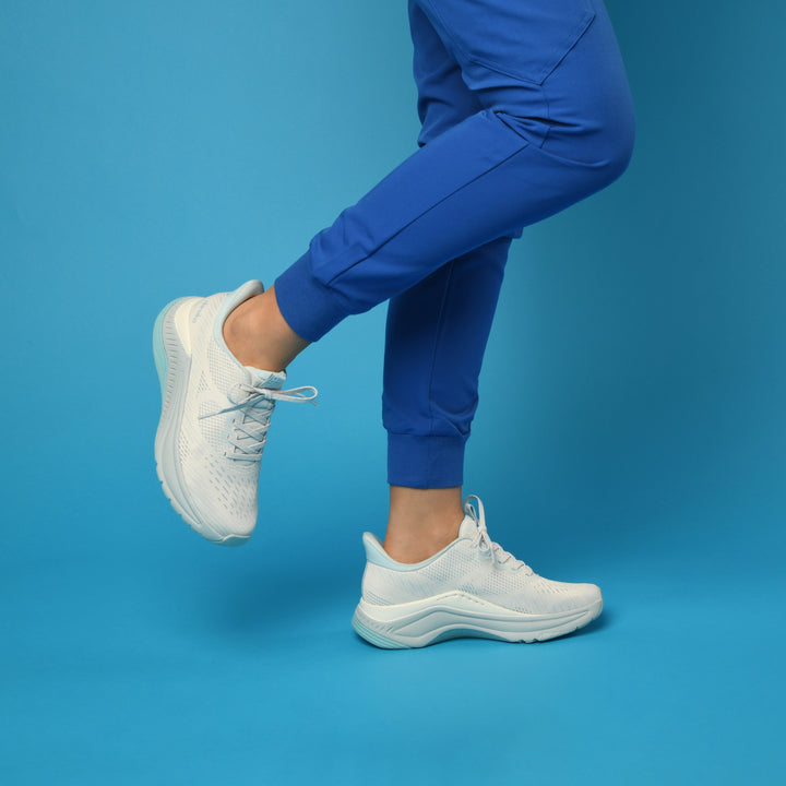 Performance walking sneakers are easy to wear, supportive, and match with many scrubs for healthcare workers.