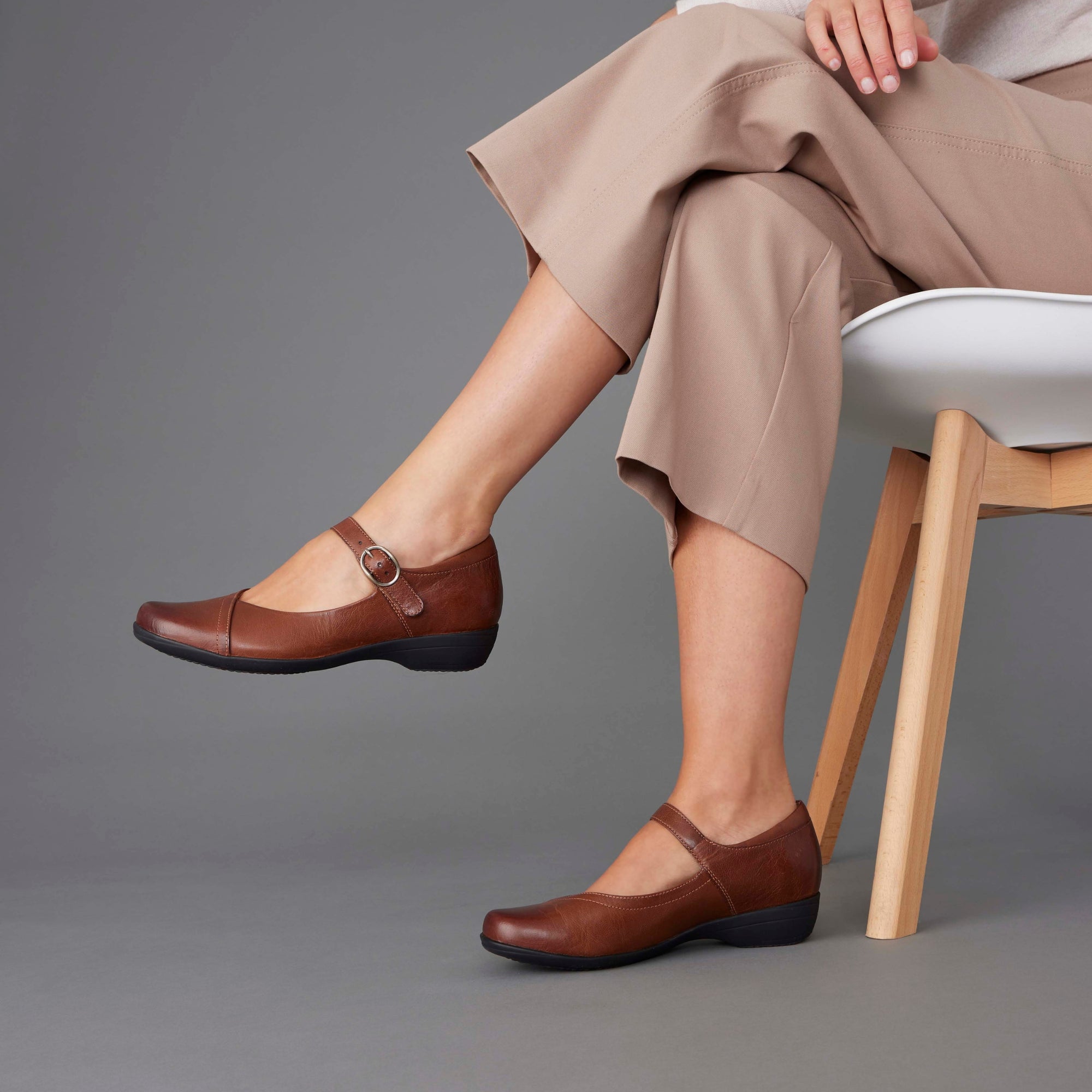 Woman wearing timeless Mary Janes in brown.
