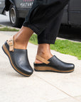 Merrin in black is a trendy and stylish clog made with high-quality materials like leather and cork for style that lasts all year.