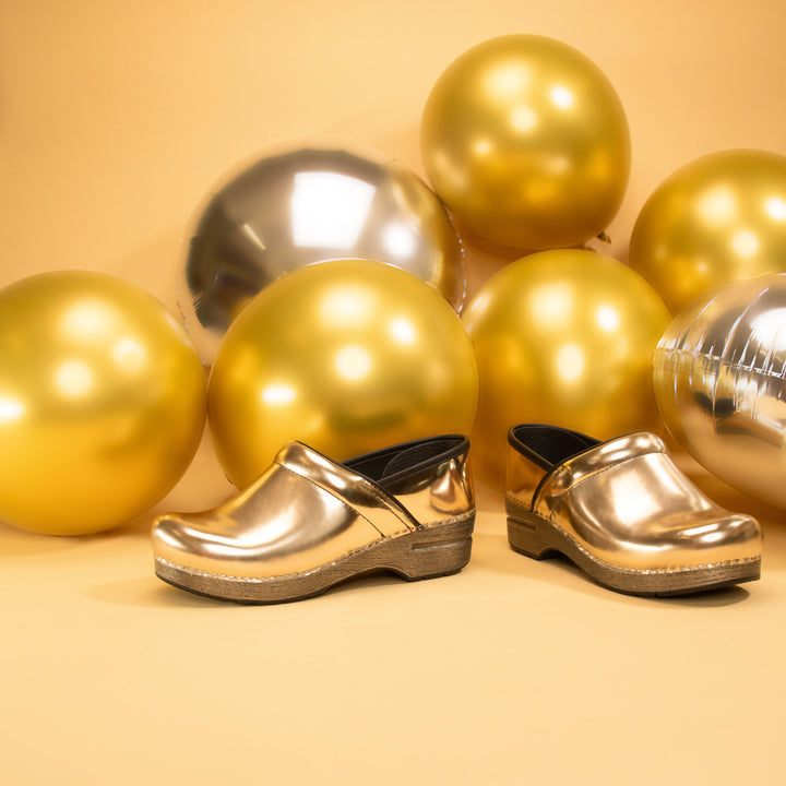 Trendy metallic leathers on a professional clog featured in gold.