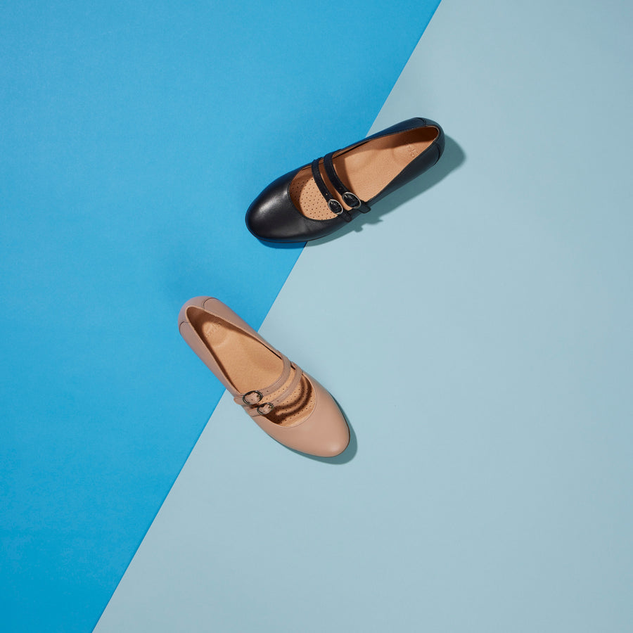 Two colors of a Mary Jane flat with a stylish two-strap design.