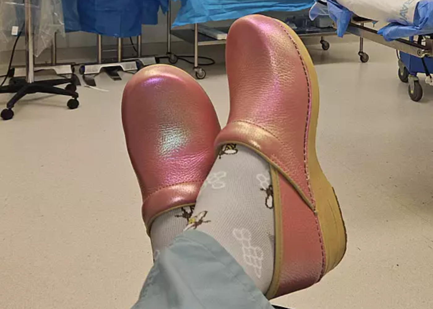 User generated image of pink iridescent clogs in healthcare setting.